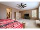 Main bedroom with a king-size bed and an ensuite bathroom at 16933 W Oasis Springs Way, Surprise, AZ 85387