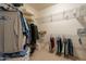 Walk-in closet with ample shelving and hanging space at 16933 W Oasis Springs Way, Surprise, AZ 85387