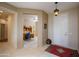 Inviting entryway with view to home office and tile flooring at 16933 W Oasis Springs Way, Surprise, AZ 85387