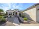 Front exterior view of single-story home with landscaped yard at 16933 W Oasis Springs Way, Surprise, AZ 85387