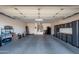Attached garage with storage cabinets and shelving at 16933 W Oasis Springs Way, Surprise, AZ 85387