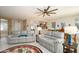Open concept living room with views to kitchen and dining areas at 16933 W Oasis Springs Way, Surprise, AZ 85387