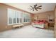Relaxing main bedroom with plush carpeting and window shutters at 16933 W Oasis Springs Way, Surprise, AZ 85387