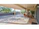 Covered patio with seating area, perfect for outdoor dining and relaxation at 16933 W Oasis Springs Way, Surprise, AZ 85387
