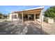 Covered patio with seating area and built-in grill at 16933 W Oasis Springs Way, Surprise, AZ 85387