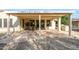 Covered patio features a table and chairs for outdoor dining at 16933 W Oasis Springs Way, Surprise, AZ 85387