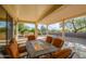 Outdoor patio with seating area and built-in grill at 16933 W Oasis Springs Way, Surprise, AZ 85387
