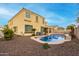 Lush backyard oasis featuring a kidney-shaped pool at 17881 W Larkspur Dr, Surprise, AZ 85388