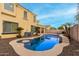 Enjoy this beautiful kidney-shaped pool in your backyard at 17881 W Larkspur Dr, Surprise, AZ 85388