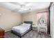 Cozy bedroom with gray bed frame and soft carpet at 17881 W Larkspur Dr, Surprise, AZ 85388