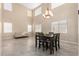 Bright dining room with high ceilings and chandelier at 17881 W Larkspur Dr, Surprise, AZ 85388