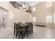 Spacious dining area with high ceilings and a chandelier at 17881 W Larkspur Dr, Surprise, AZ 85388