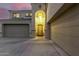 Two-story entryway with a large chandelier and double door entry at 17881 W Larkspur Dr, Surprise, AZ 85388