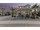 Two-story house with a landscaped yard, large windows, and a three-car garage at 17881 W Larkspur Dr, Surprise, AZ 85388