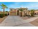 Two-story house with a landscaped yard, large windows, and a three-car garage at 17881 W Larkspur Dr, Surprise, AZ 85388