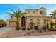Two-story house with a landscaped yard, large windows, and a three-car garage at 17881 W Larkspur Dr, Surprise, AZ 85388