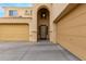 Two-story house entrance with double doors and arched entryway at 17881 W Larkspur Dr, Surprise, AZ 85388