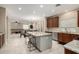 Open kitchen with large island and stainless steel appliances at 17881 W Larkspur Dr, Surprise, AZ 85388