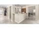 Kitchen features a corner breakfast bar with granite countertops at 17881 W Larkspur Dr, Surprise, AZ 85388