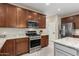 Bright kitchen with stainless steel appliances and granite countertops at 17881 W Larkspur Dr, Surprise, AZ 85388