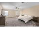 Large main bedroom with carpeted floors and lots of natural light at 17881 W Larkspur Dr, Surprise, AZ 85388