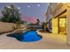 Relaxing pool area with a water feature and covered patio at 17881 W Larkspur Dr, Surprise, AZ 85388