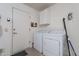 Laundry room with washer, dryer, and storage cabinets at 1812 E Peach Tree Dr, Chandler, AZ 85249