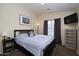 Bedroom with a queen bed, nightstand, and dresser at 280 S Evergreen Rd # 1270, Tempe, AZ 85288