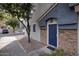 Townhome entrance with blue door and stone accents at 280 S Evergreen Rd # 1270, Tempe, AZ 85288