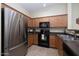 Kitchen with stainless steel fridge and dark counters at 280 S Evergreen Rd # 1270, Tempe, AZ 85288