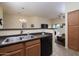Kitchen with double sink and view into living room at 280 S Evergreen Rd # 1270, Tempe, AZ 85288