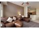 Living room with leather furniture and open kitchen view at 280 S Evergreen Rd # 1270, Tempe, AZ 85288