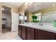 Double vanity bathroom with a large mirror and walk-in closet at 33242 N Jamie Ln, San Tan Valley, AZ 85144