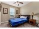 Guest bedroom with ceiling fan and window at 33242 N Jamie Ln, San Tan Valley, AZ 85144