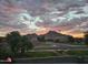 Scenic community view with sunset and mountain backdrop at 33242 N Jamie Ln, San Tan Valley, AZ 85144