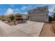 Two-story house with a large front yard, two-car garage, and neutral color scheme at 33242 N Jamie Ln, San Tan Valley, AZ 85144