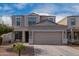 Two-story house with a two-car garage and well-maintained landscaping at 33242 N Jamie Ln, San Tan Valley, AZ 85144