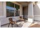 Small front porch with two wicker chairs, ideal for relaxing at 33242 N Jamie Ln, San Tan Valley, AZ 85144
