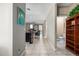 Bright hallway with tile flooring, leading to living areas and bathroom at 33242 N Jamie Ln, San Tan Valley, AZ 85144