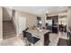Island kitchen with granite countertops, stainless steel appliances, and dark wood cabinetry at 33242 N Jamie Ln, San Tan Valley, AZ 85144