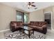 Living room with two brown sofas and a coffee table at 33242 N Jamie Ln, San Tan Valley, AZ 85144