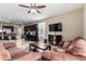 Open living space with kitchen view, comfortable seating, and flat-screen TV at 33242 N Jamie Ln, San Tan Valley, AZ 85144
