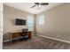 Home office with a desk and chair near window at 33242 N Jamie Ln, San Tan Valley, AZ 85144