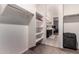 Large walk-in closet with shelves and hanging rod at 33242 N Jamie Ln, San Tan Valley, AZ 85144