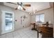 Charming dining area featuring a wood table and access to backyard at 4160 E Calypso Ave, Mesa, AZ 85206