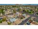High-angle aerial view of a single story home with a pool and surrounding neighborhood at 544 E Morrow Dr, Phoenix, AZ 85024