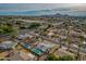 Wide aerial view of a suburban neighborhood, showcasing a single-story home and pool at 544 E Morrow Dr, Phoenix, AZ 85024