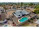 Aerial view highlighting a single-story home with a refreshing pool in the backyard at 544 E Morrow Dr, Phoenix, AZ 85024