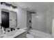 Contemporary bathroom with white vanity, subway tile, and a bathtub at 544 E Morrow Dr, Phoenix, AZ 85024