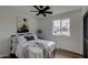Spacious bedroom with queen bed, ceiling fan, and wall art at 544 E Morrow Dr, Phoenix, AZ 85024